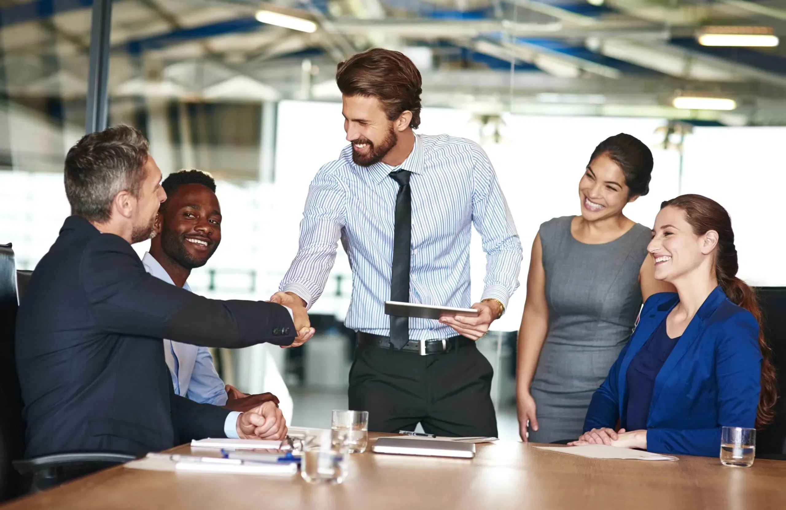 A collaborative business meeting highlighting managerial effectiveness and leadership strategies to build employee loyalty in Orlando, FL.