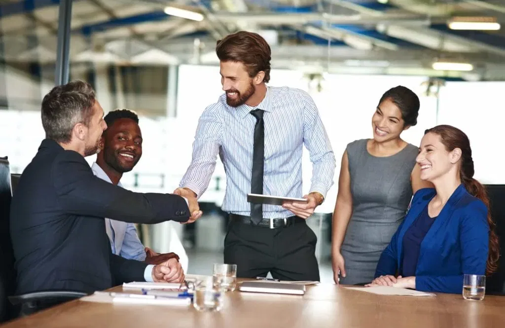 A collaborative business meeting highlighting managerial effectiveness and leadership strategies to build employee loyalty in Orlando, FL.